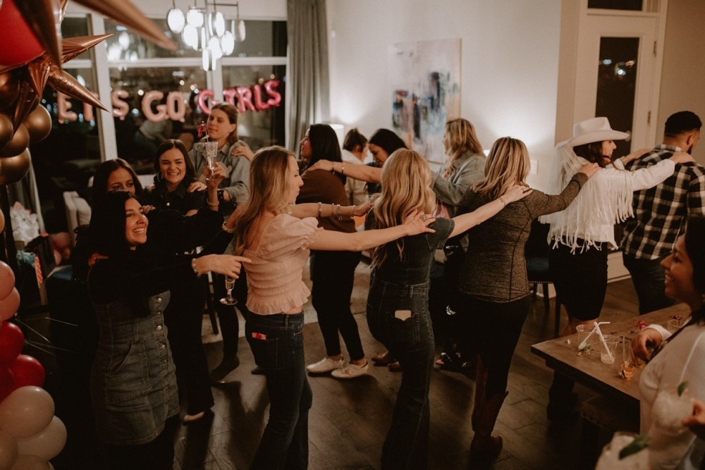 a group of people standing in a room