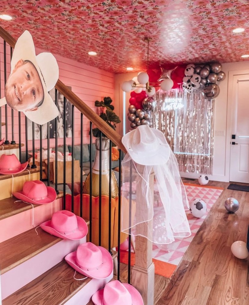 a room filled with pink flowers on a table